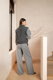 Grey sleeveless gilet women boucle with a collar, side pockets, no zipper, back view