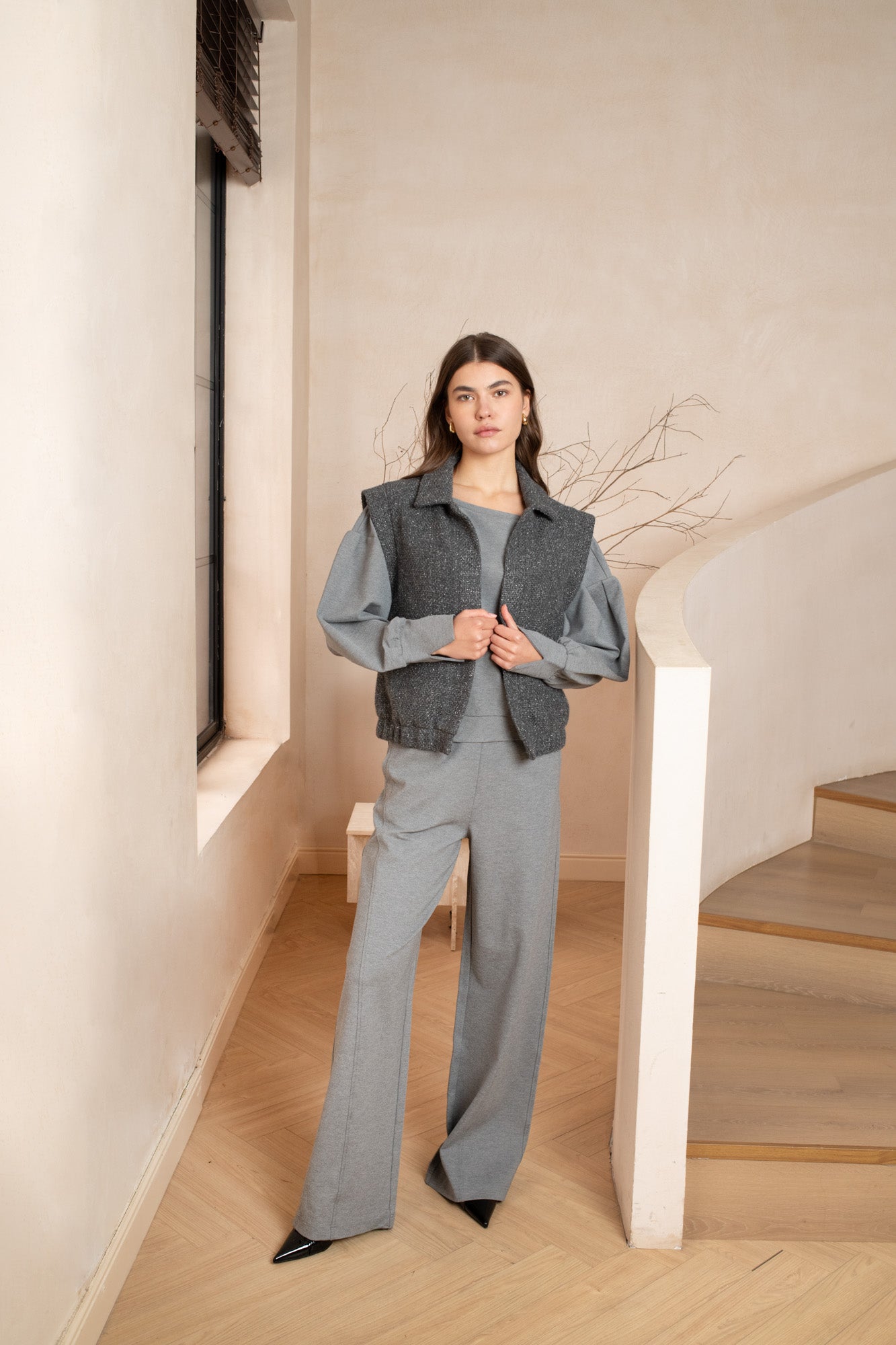 Grey sleeveless gilet women boucle with a collar, side pockets, no zipper - front view 